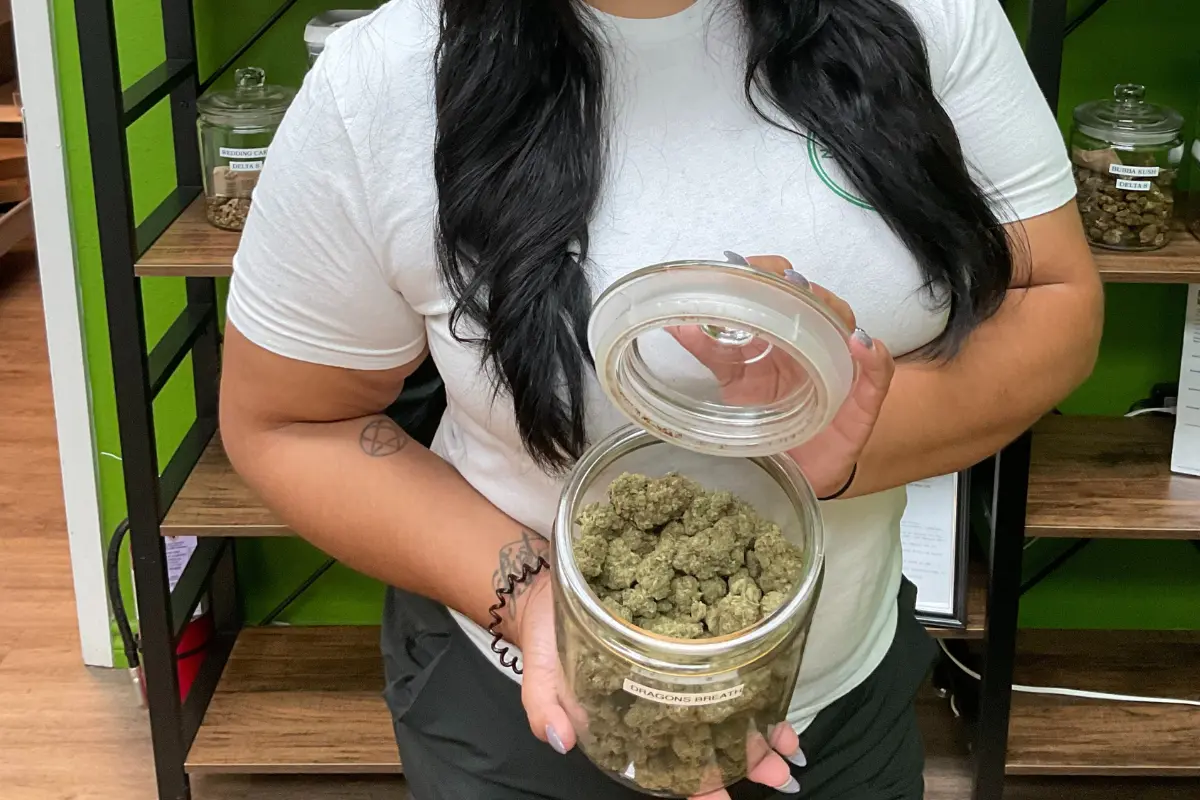 Woman holding hemp flower